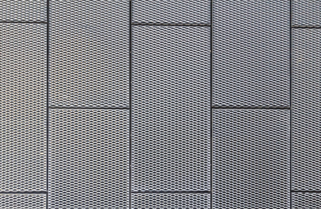 Metal panels on a ceiling with drawn grid